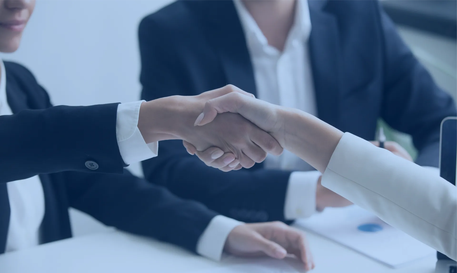 a close-up of people shaking hands